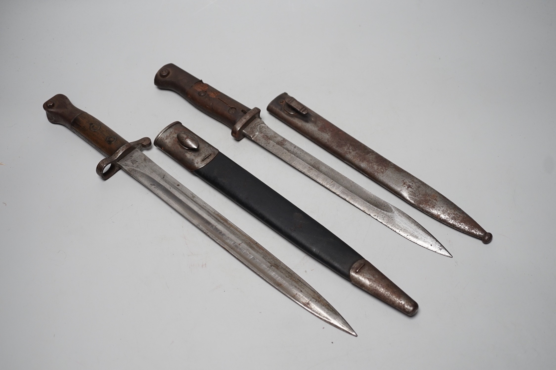 A 19th century British bayonet and scabbard together with a German bayonet and scabbard, the blade stamped Gottlieb Hammesfahr Solingen Foche